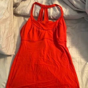 Lululemon red workout top.